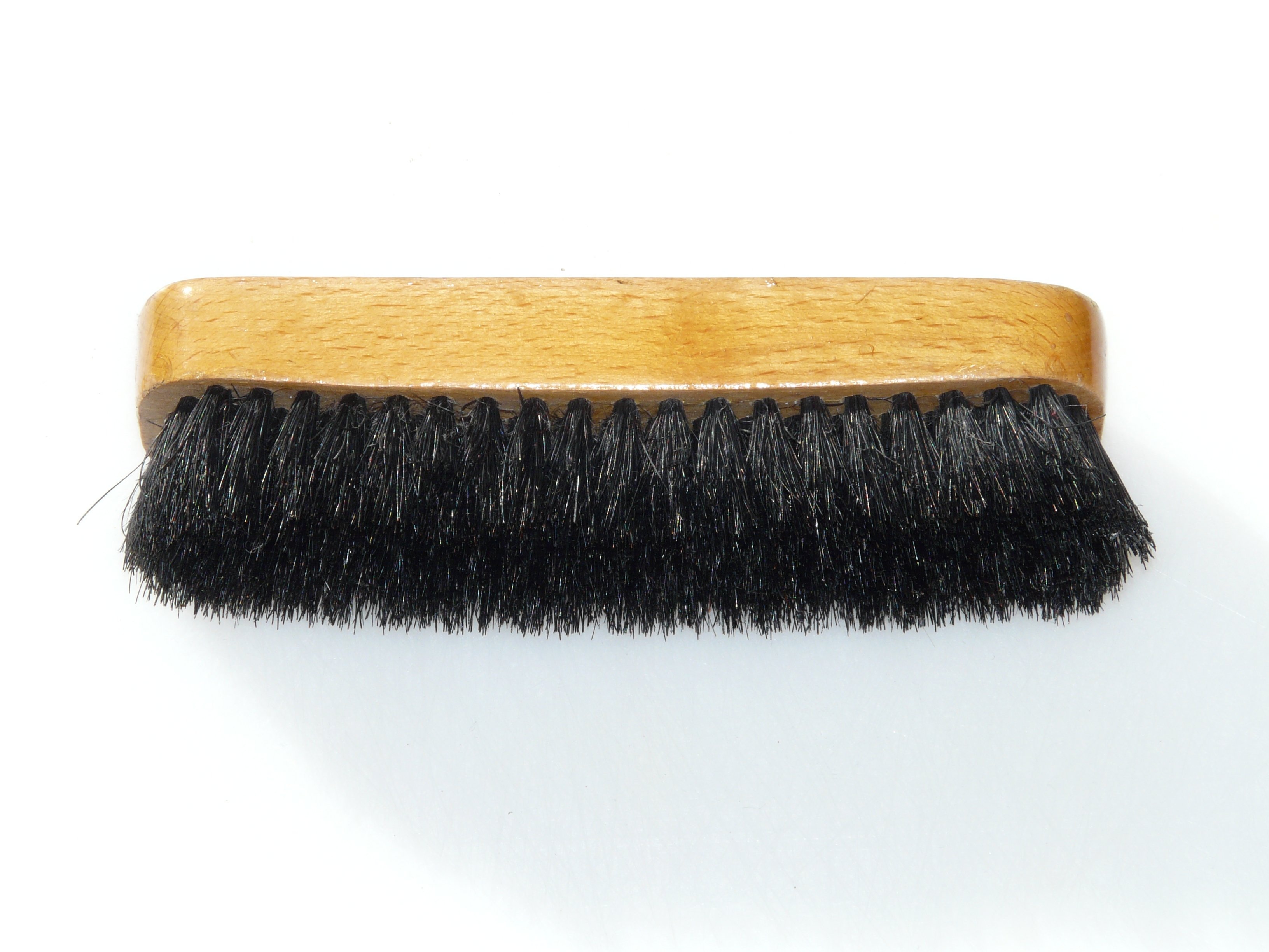 brown wood and black shoe brush