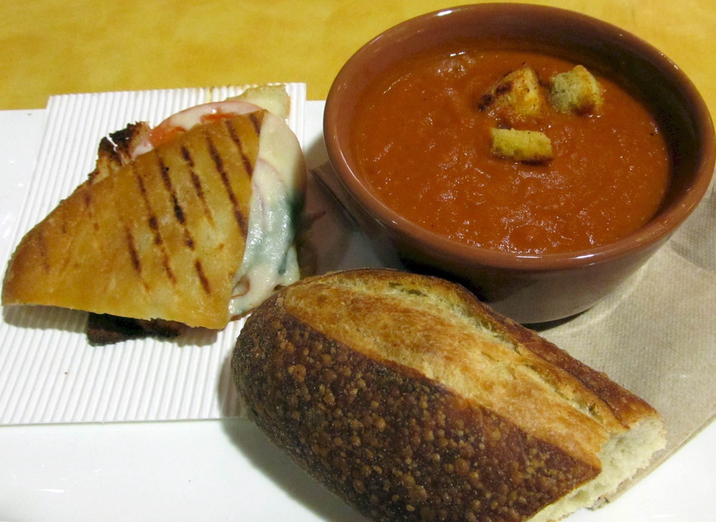 slice bread near brown ceramic bowl with sauce and pie