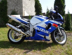 white and blue Suzuki sports bike thumbnail