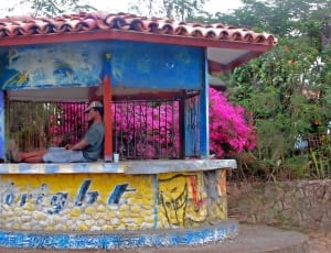 blue and yellow concrete waiting shed thumbnail