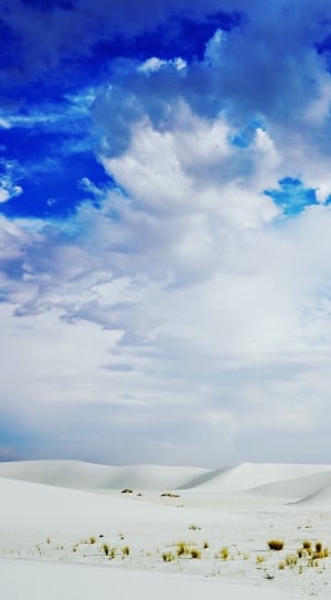 group of cumulus clouds above of white sand thumbnail