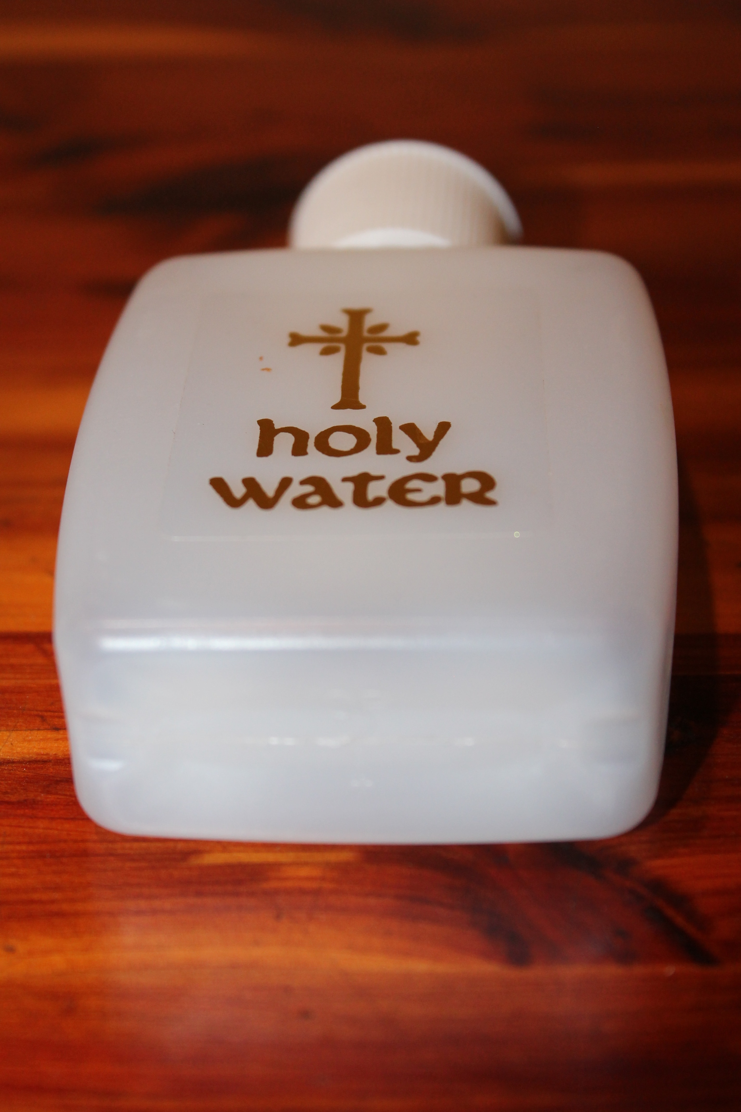 white holy water plastic bottle