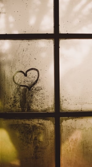 black metal window frame with heart drawing on glass thumbnail