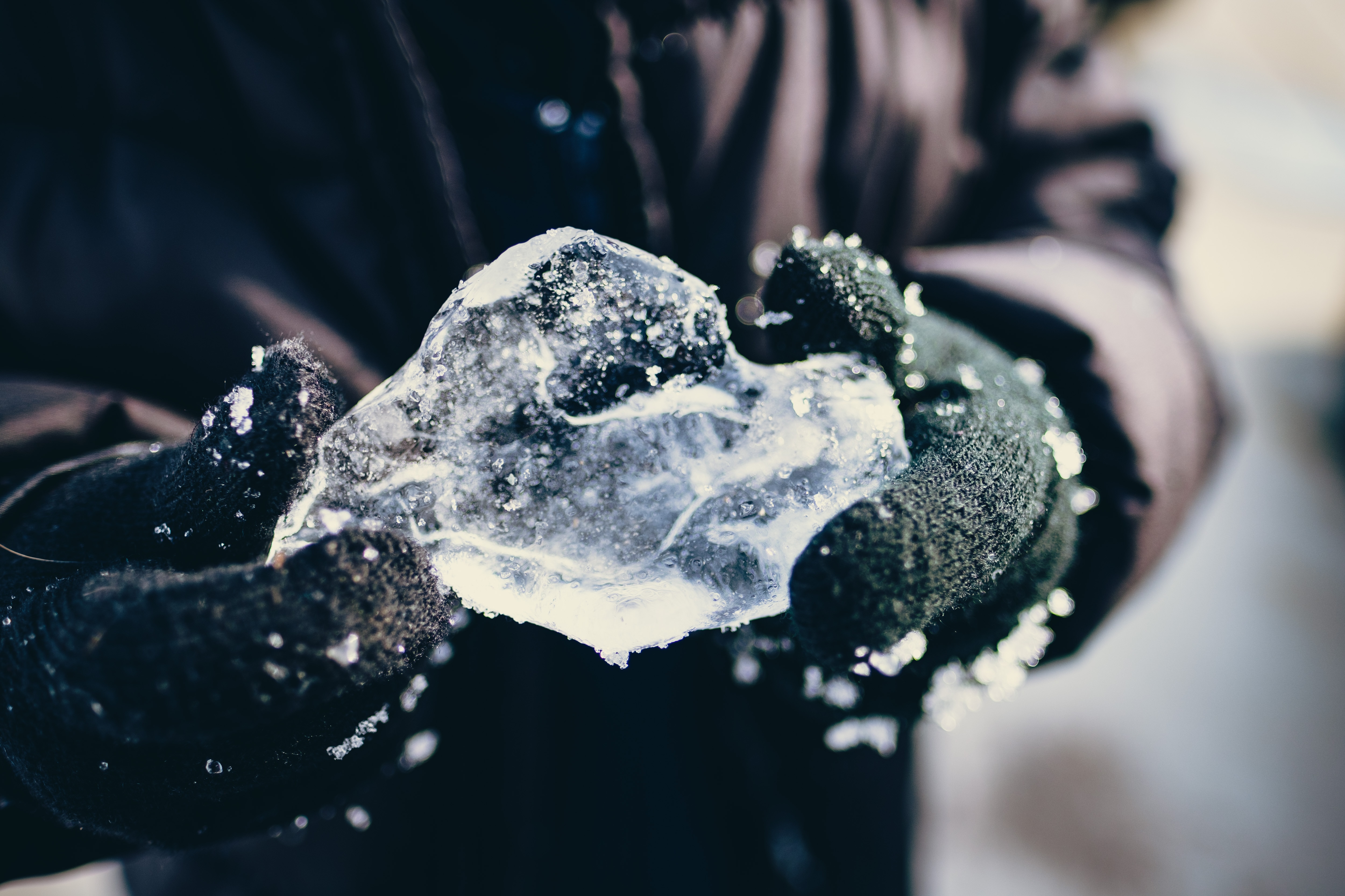 person holding ice formation