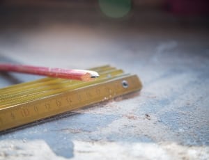 red pencil and brown wooden ruler thumbnail