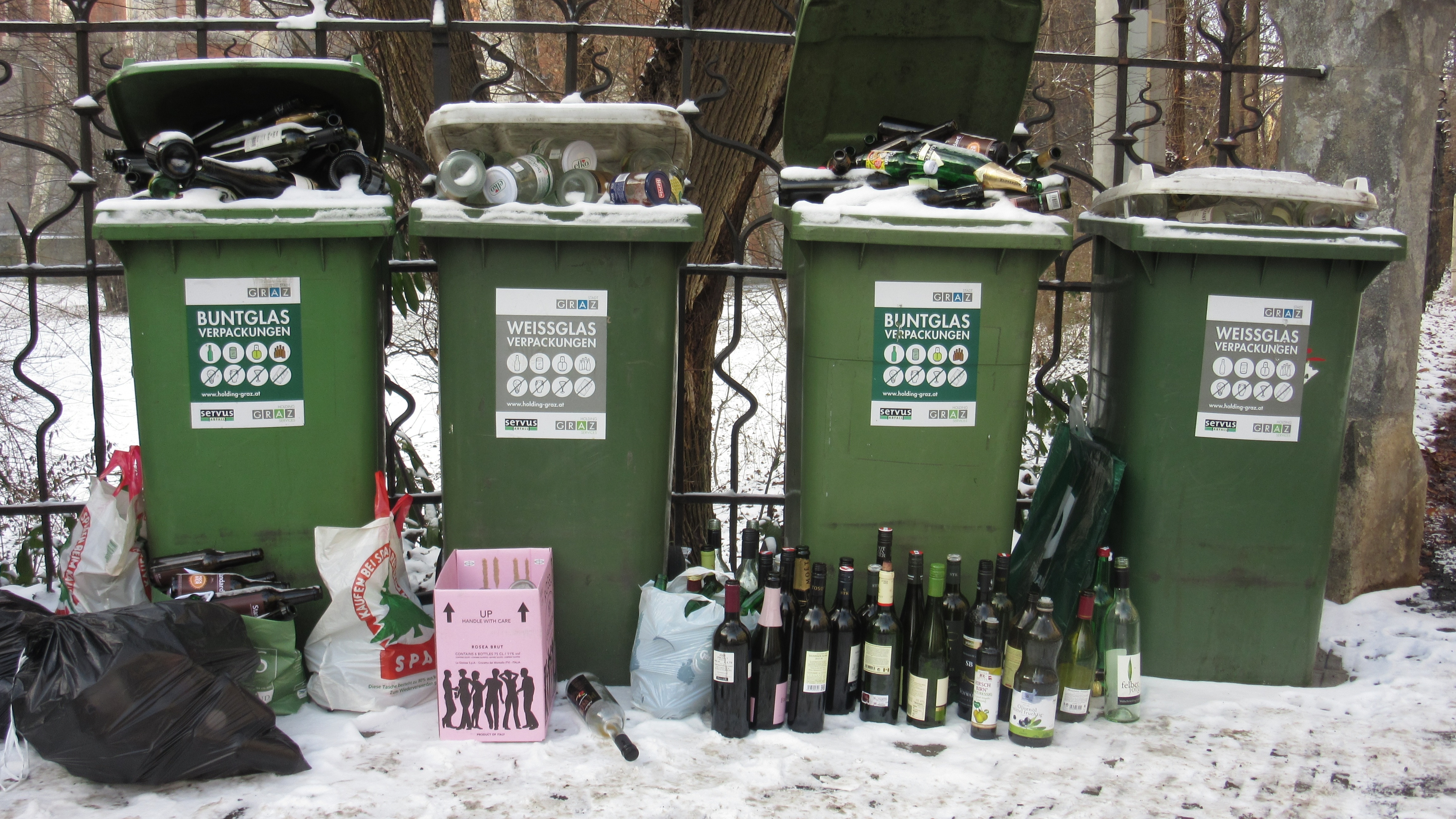 4 green plastic trash bin with bottle