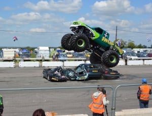 green and black swamp thing monster truck thumbnail