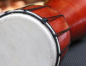 red and white wooden bongo drum thumbnail
