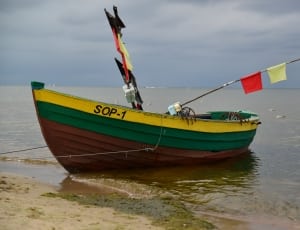 yellow green and brown boat thumbnail