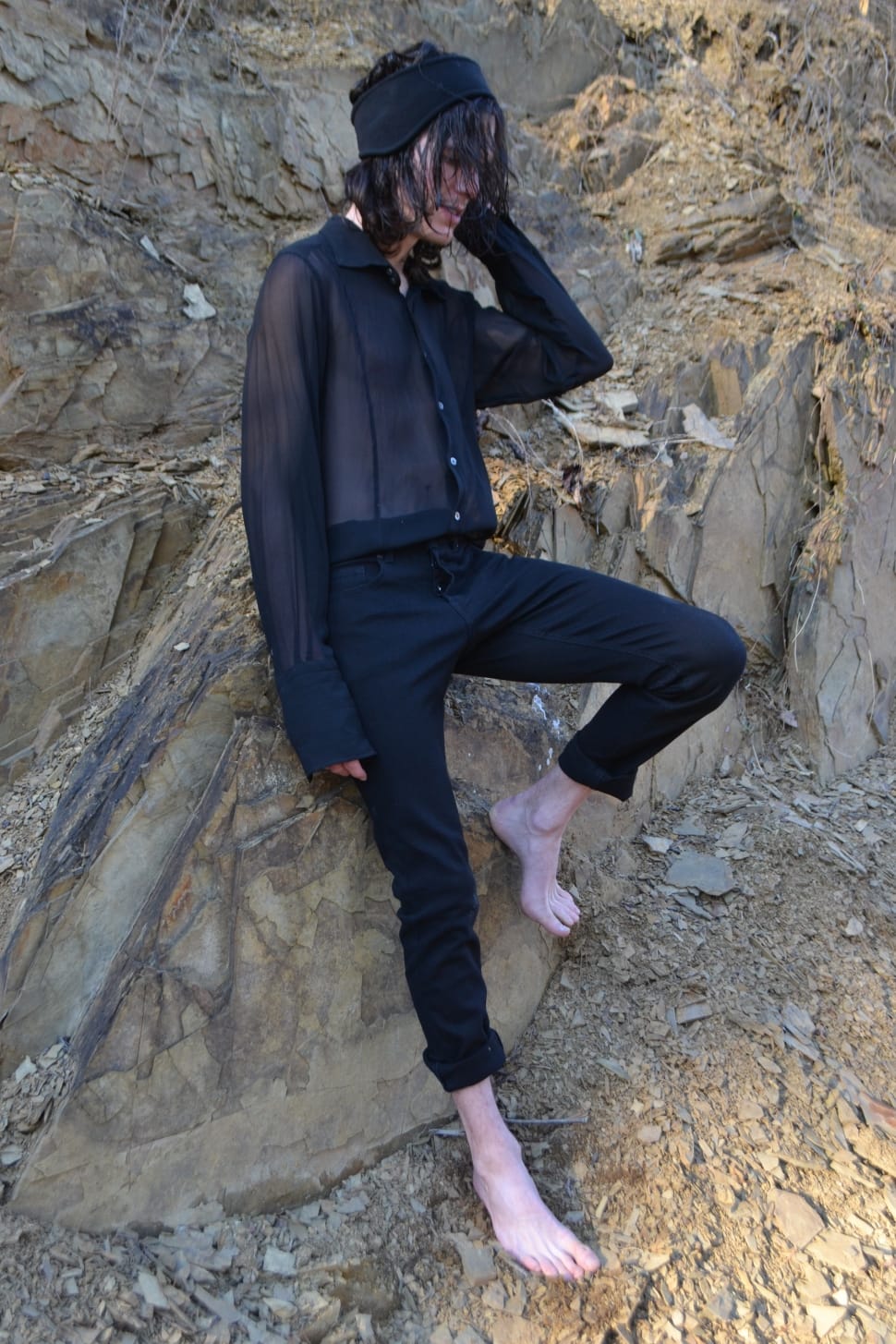 man in black illusion dress shirt and pants preview