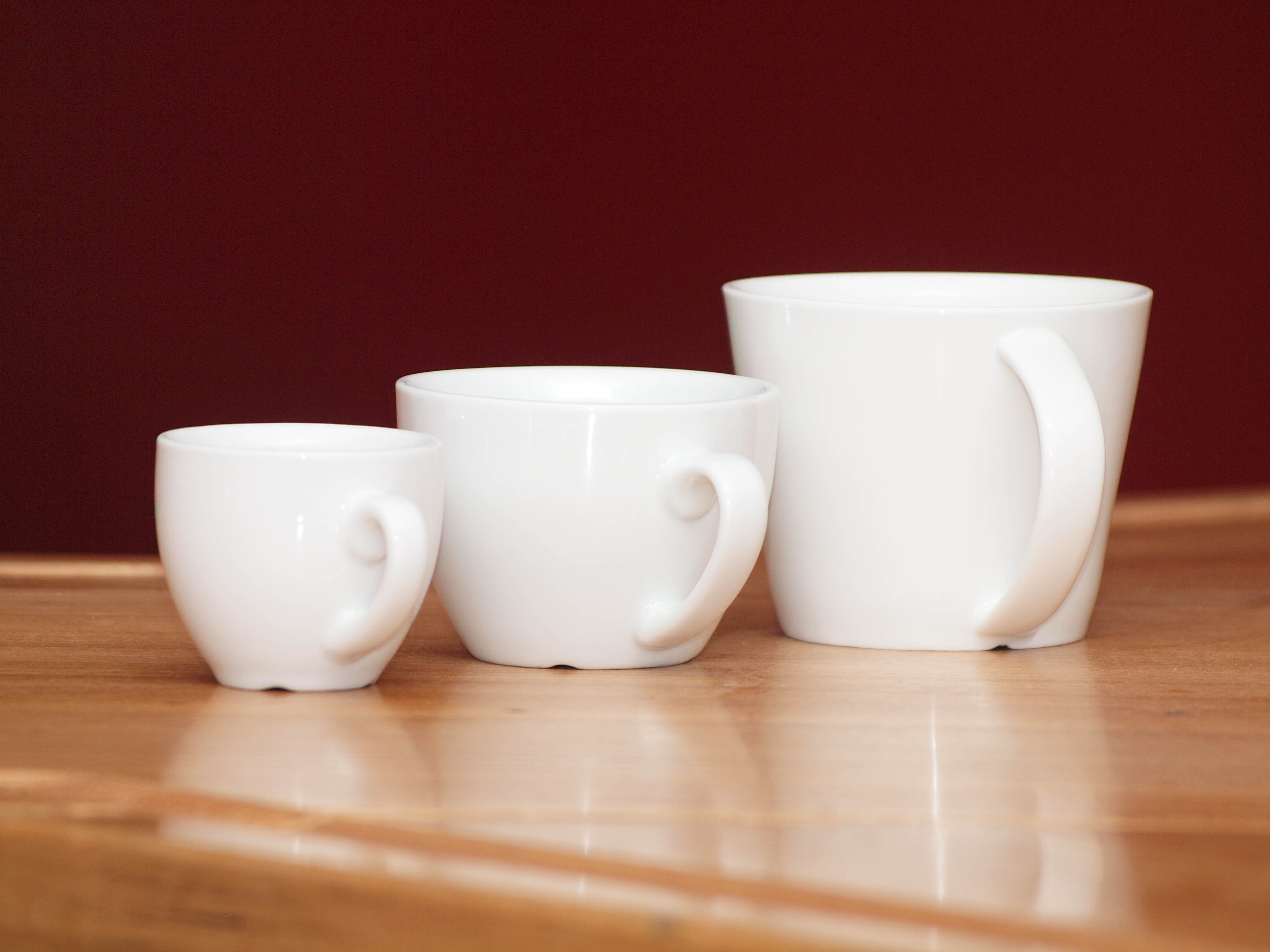 3 white ceramic mugs