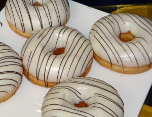 four white glazed doughnuts thumbnail