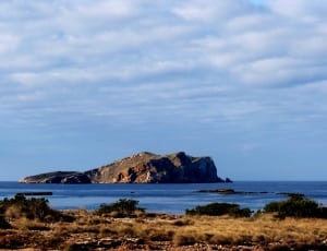 island and body of water landscape photo thumbnail