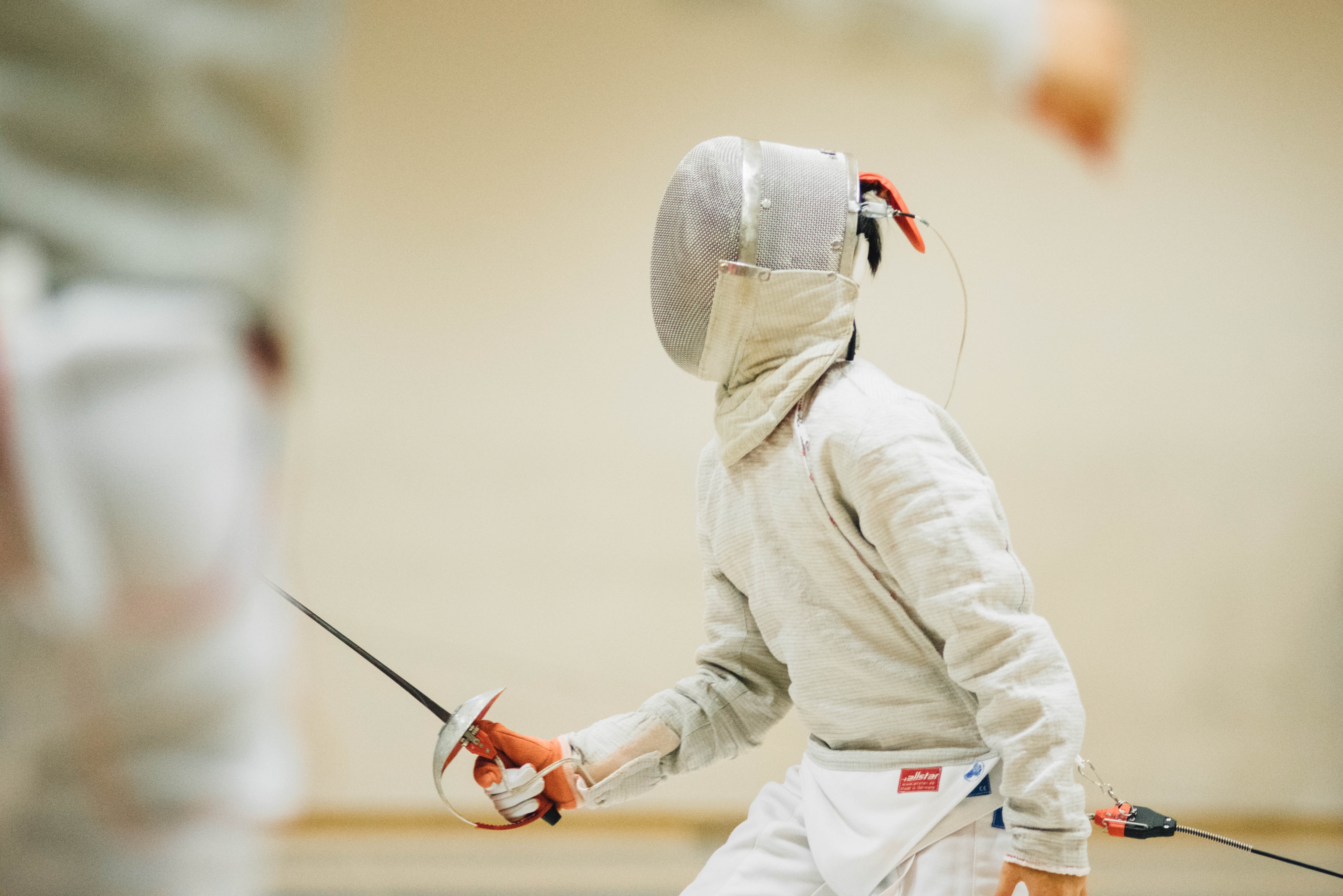 person in fencing suit