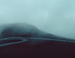 road covered by fog thumbnail