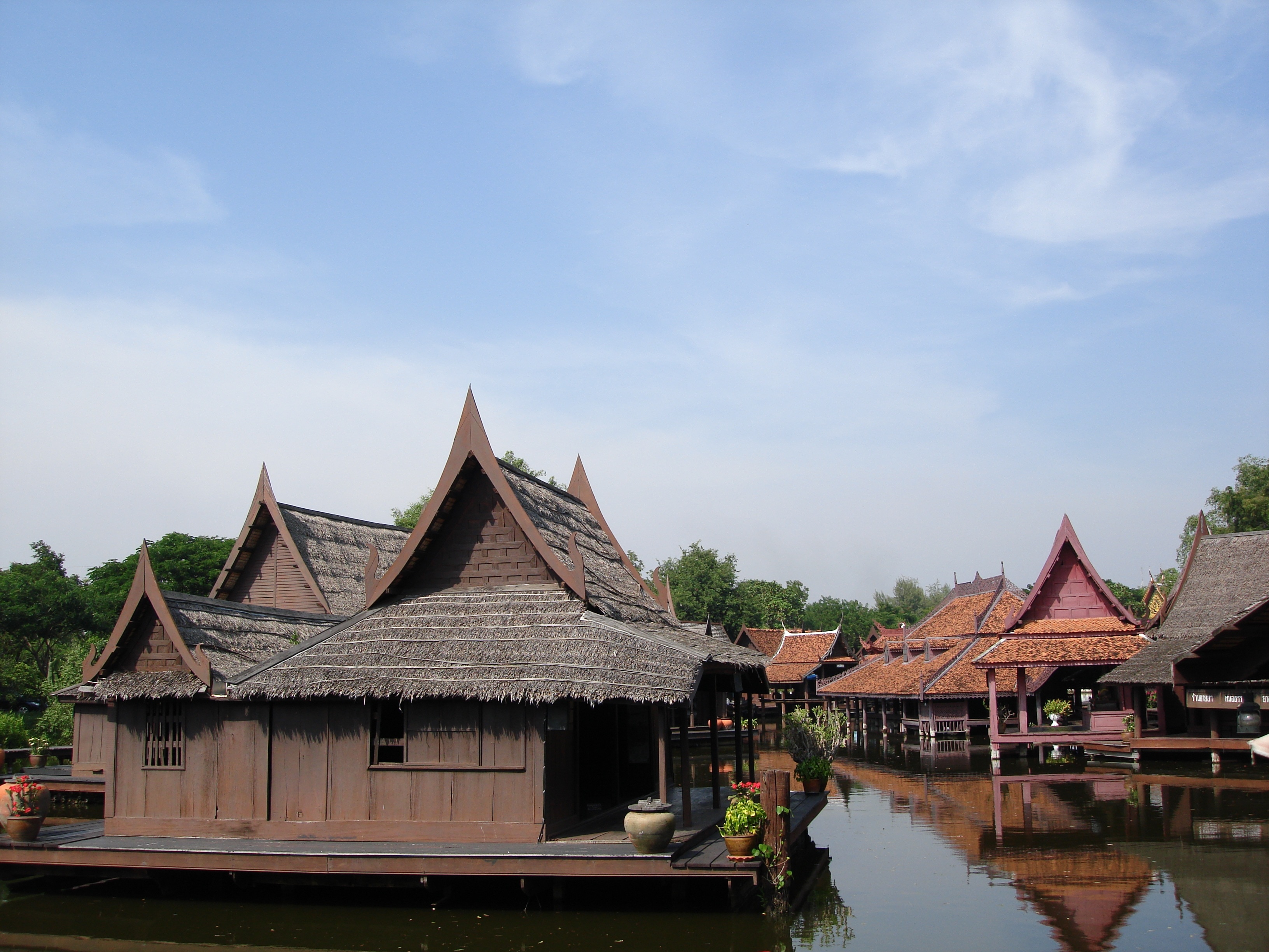 wooden houses near body of water