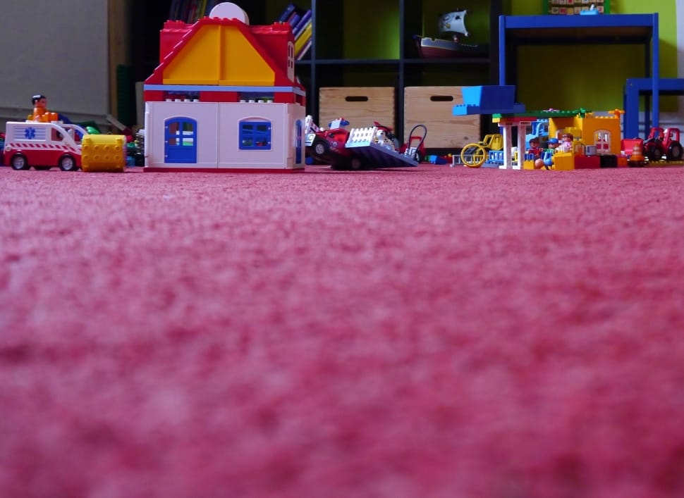 plastic toys on a pink carpet preview