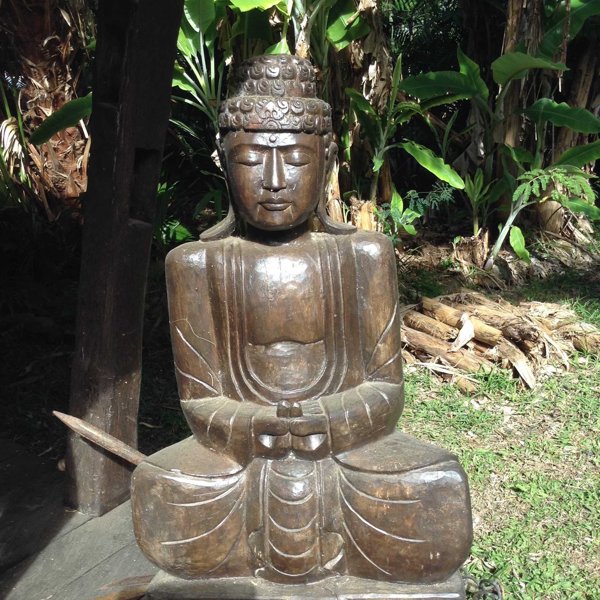 brown wooden buddha figurine