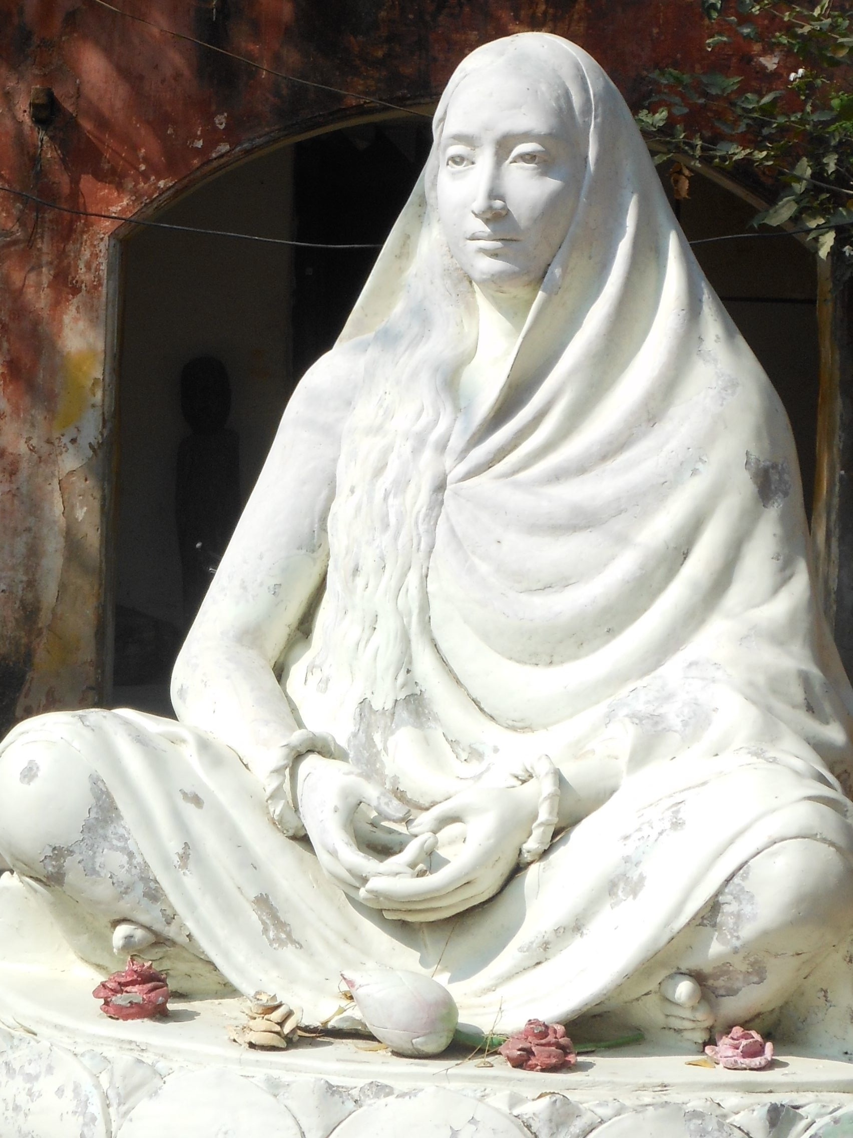 woman sitting concrete statue