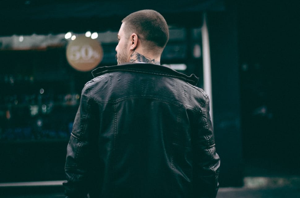 man in black leather jacket with skin tattoo preview