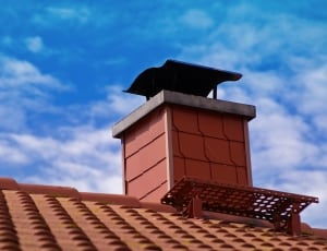 orange chimney under blue sky during day time thumbnail