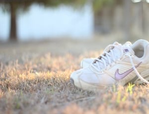 white and pink nike athlete shoes thumbnail