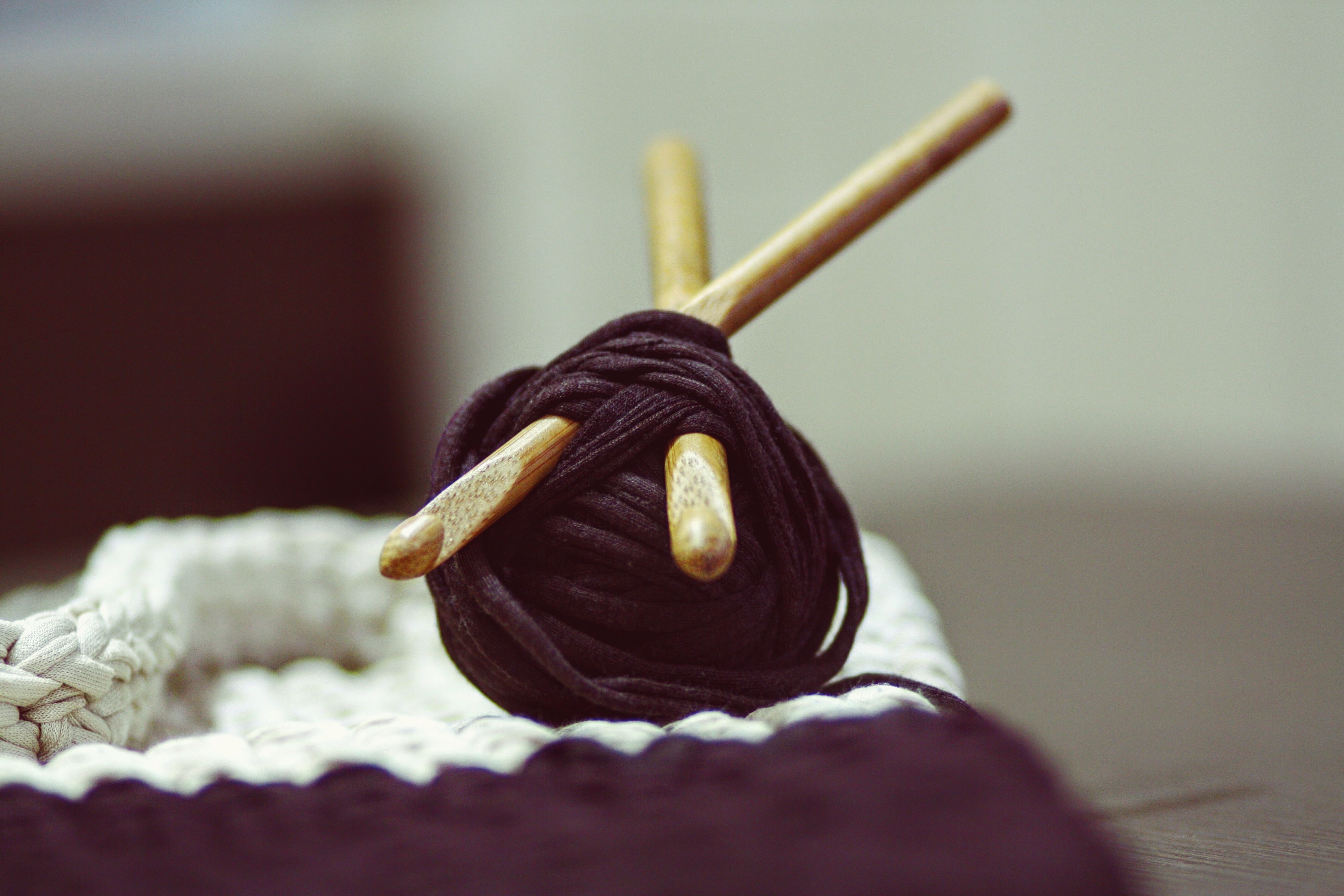 brown yarn on white textile