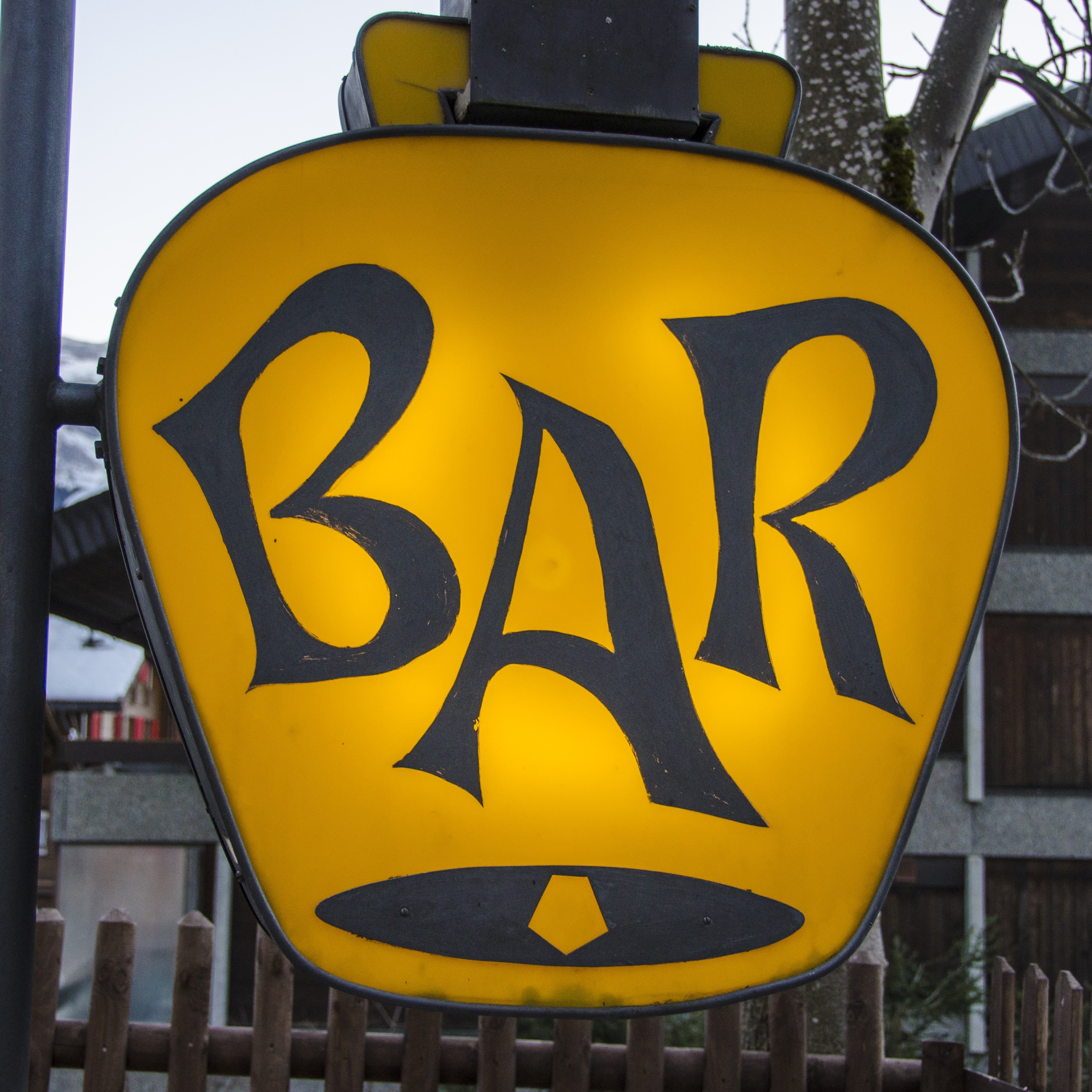 yellow and black bar signage