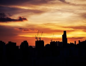 silhouette of buildings under sunset thumbnail
