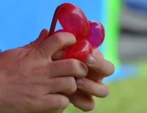 person holding a red balloon thumbnail