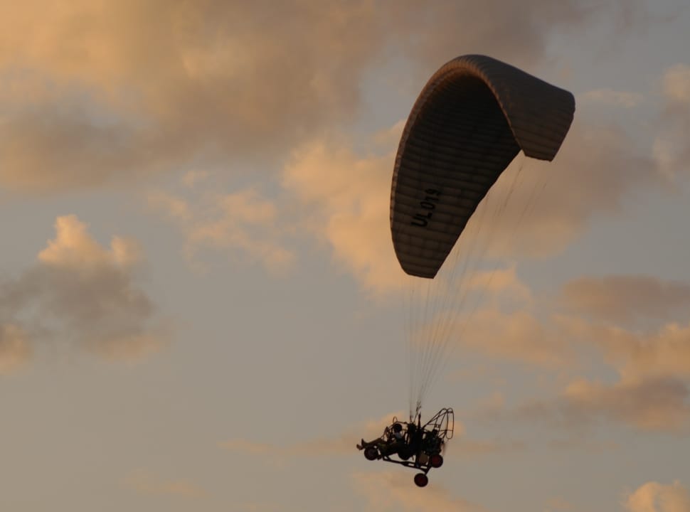 paragliding during sun set preview