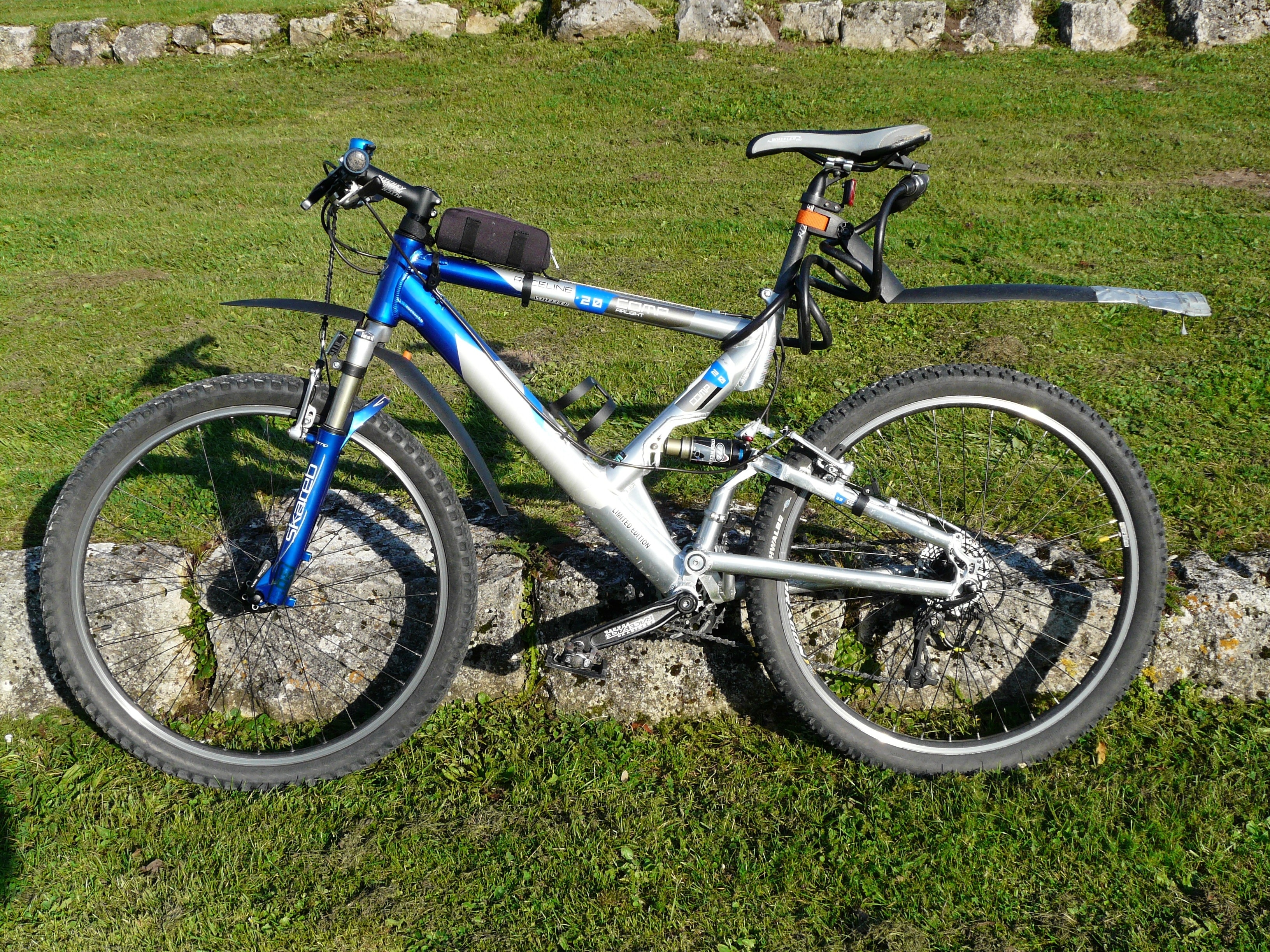 blue and gray full suspension bike