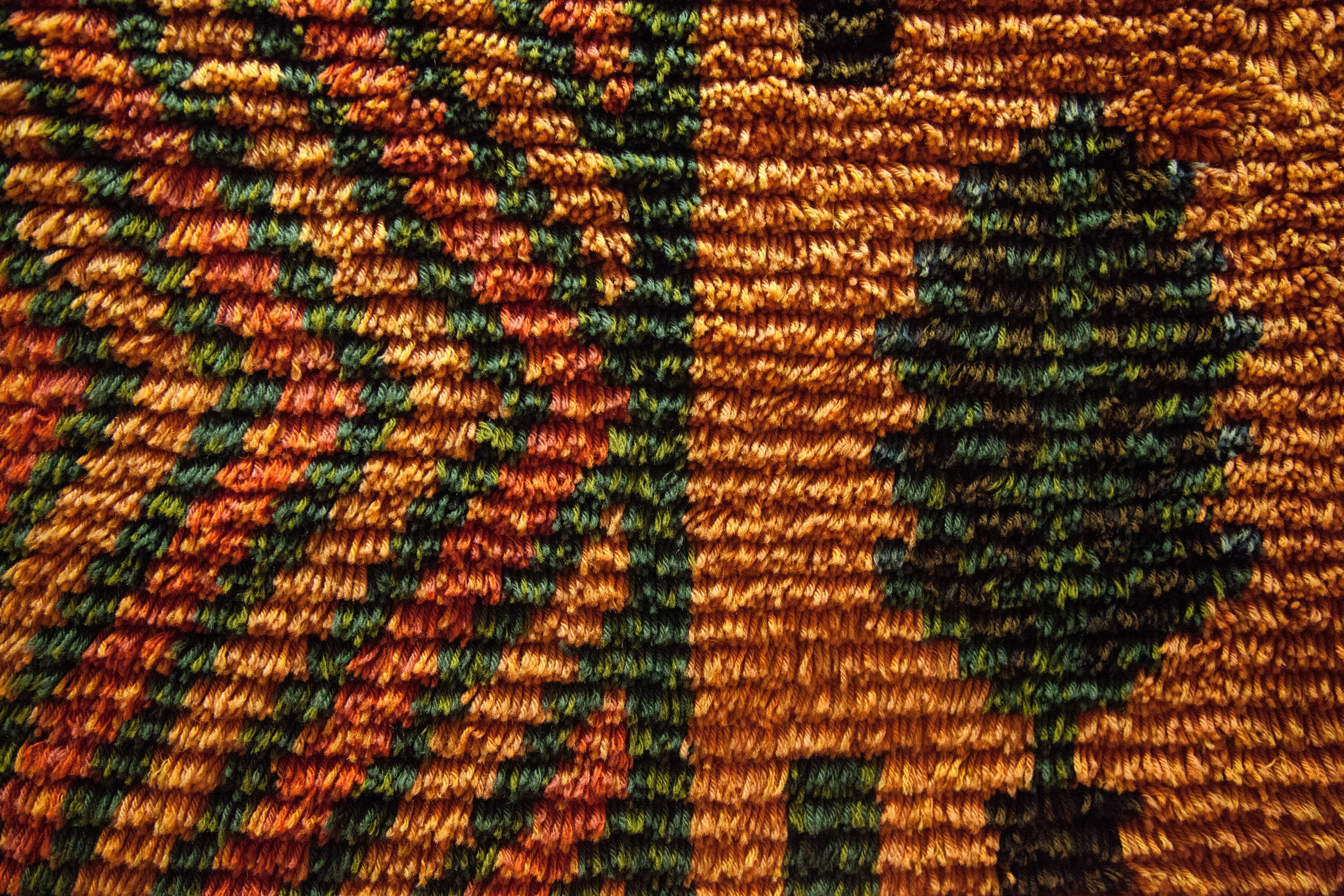 green and brown knitted tree textile