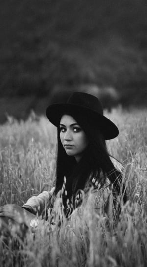 grayscale photography of woman in wheat field thumbnail