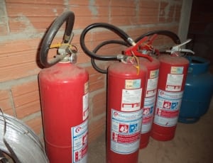 four red fire extinguishers thumbnail