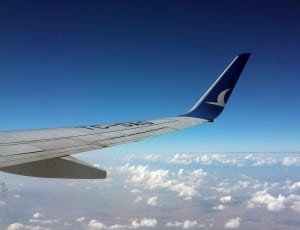 white and blue airplane wings thumbnail