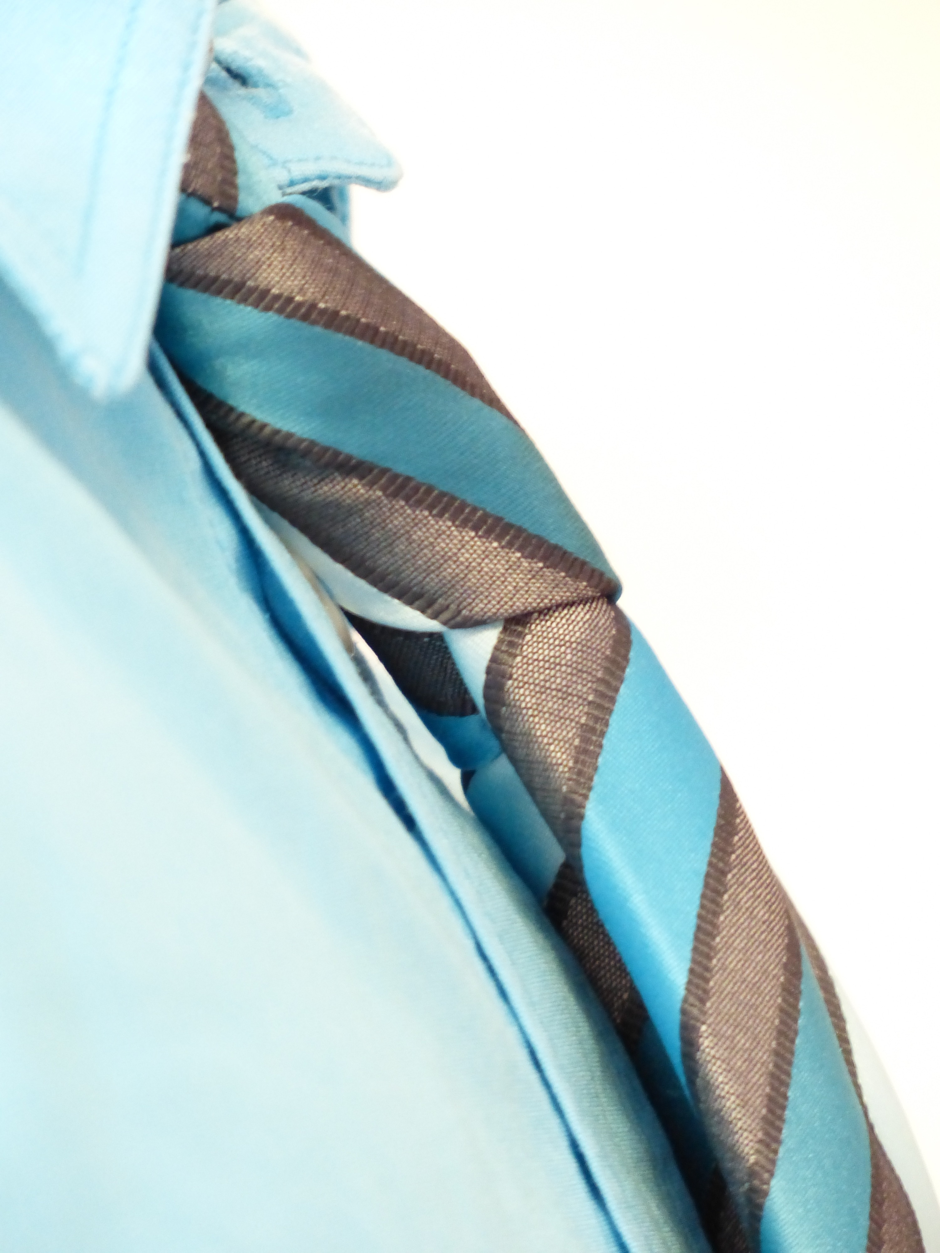 men's brown and teal necktie