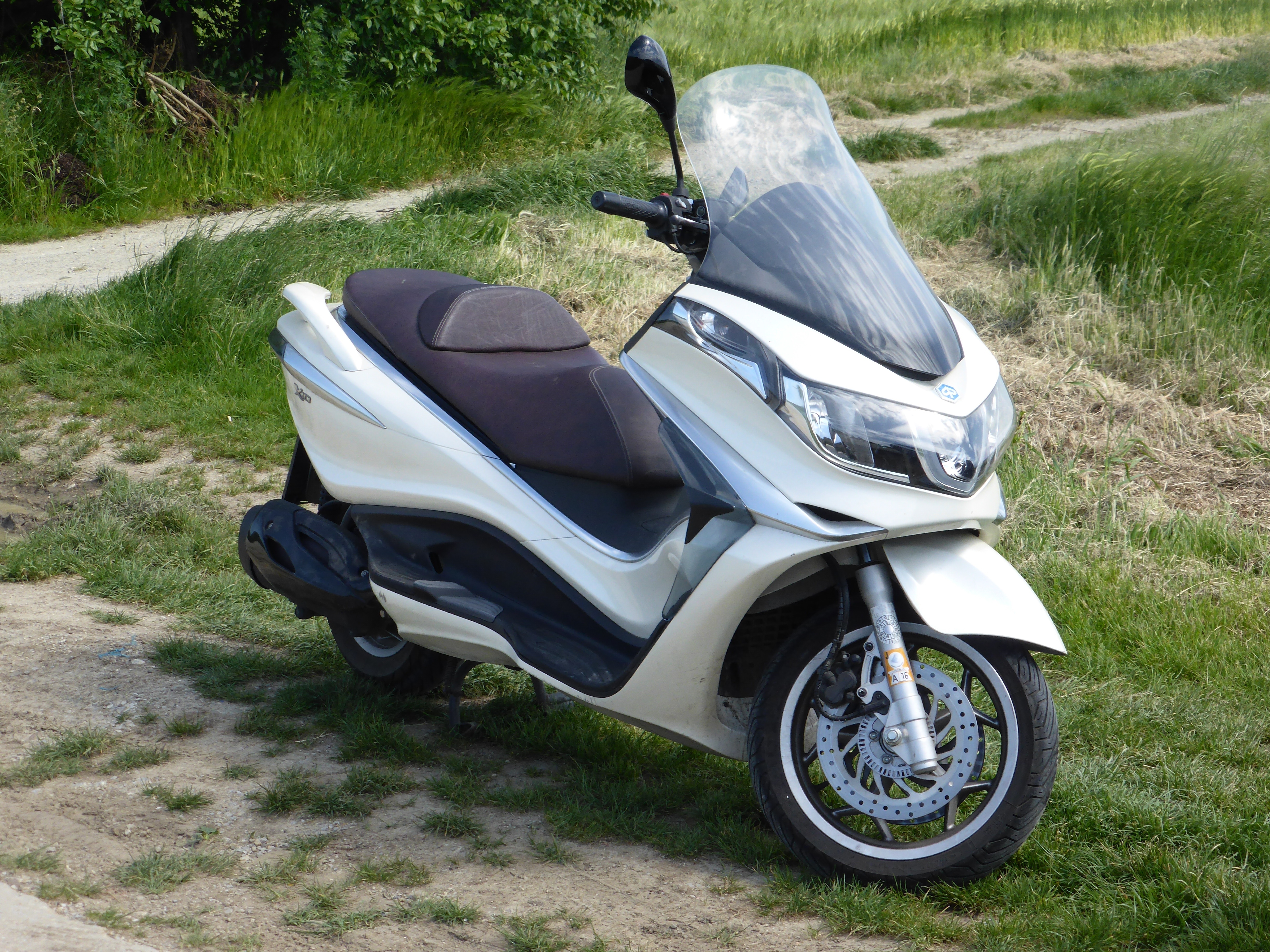 white black motor scooter