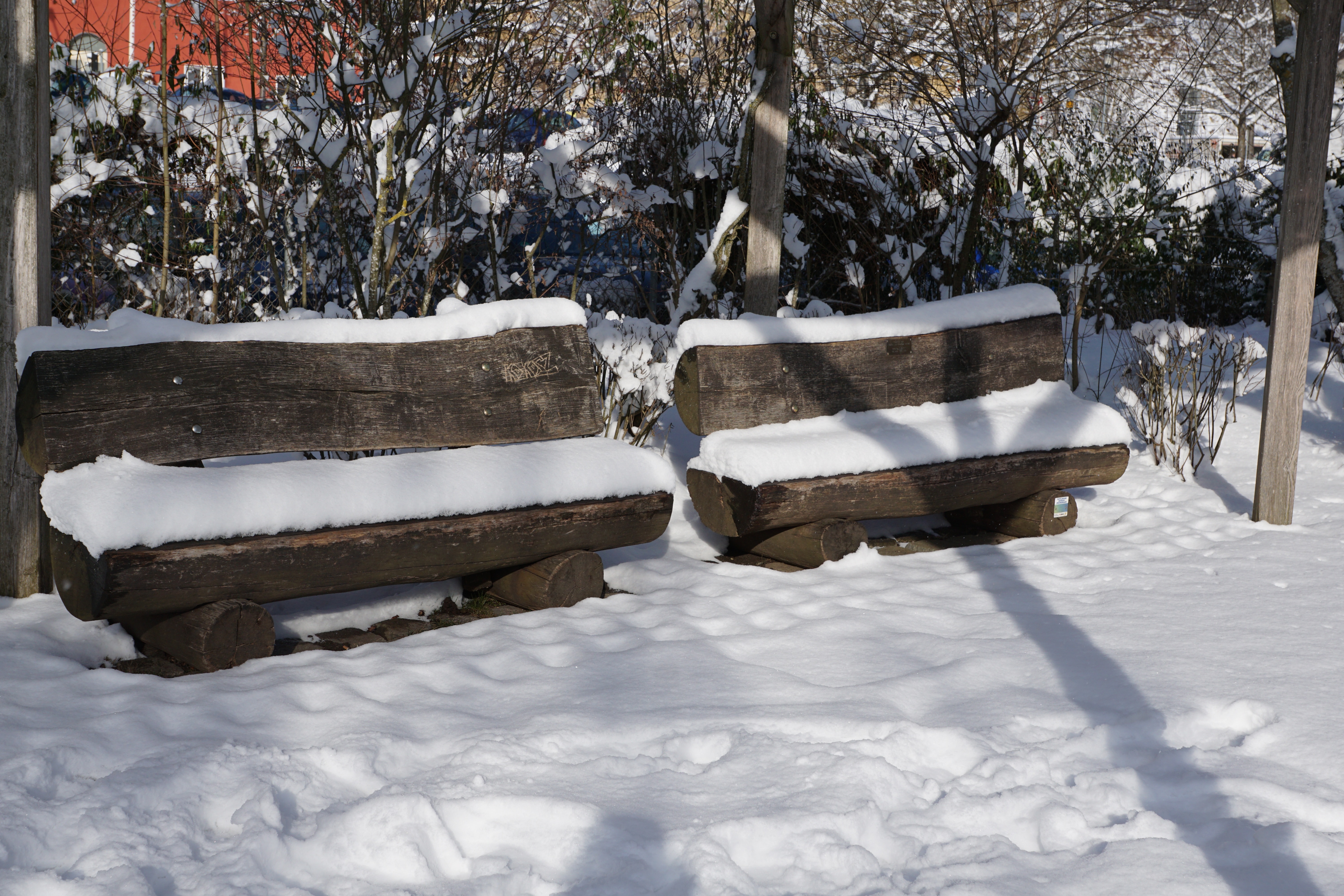 2 brown wooden benches