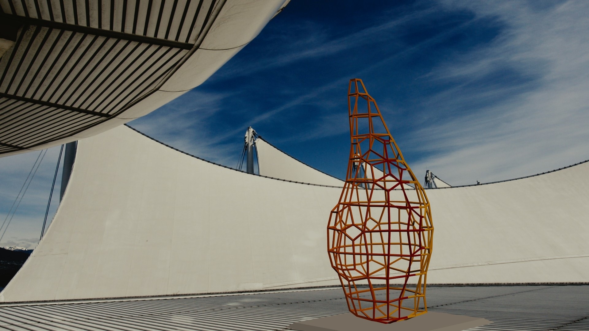 yellow and red steel suspension statue