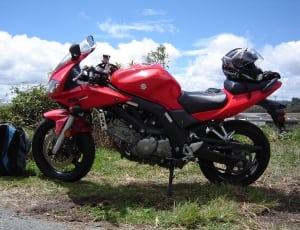 red and black suzuki sports motorcycle thumbnail