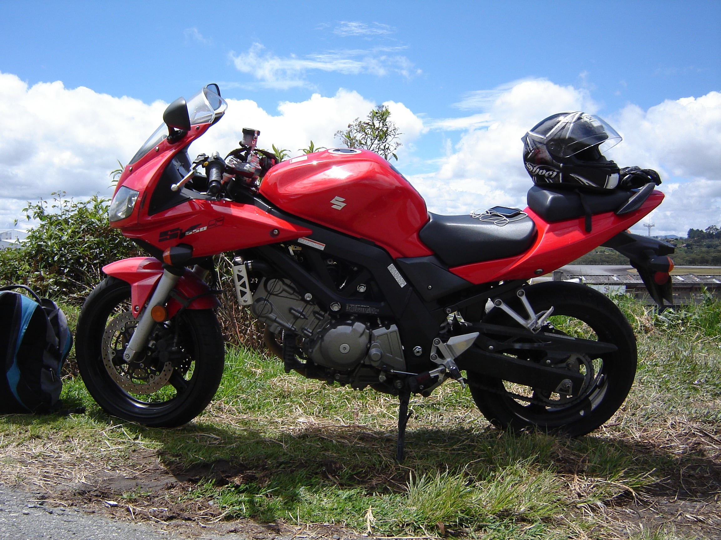 red and black suzuki sports motorcycle