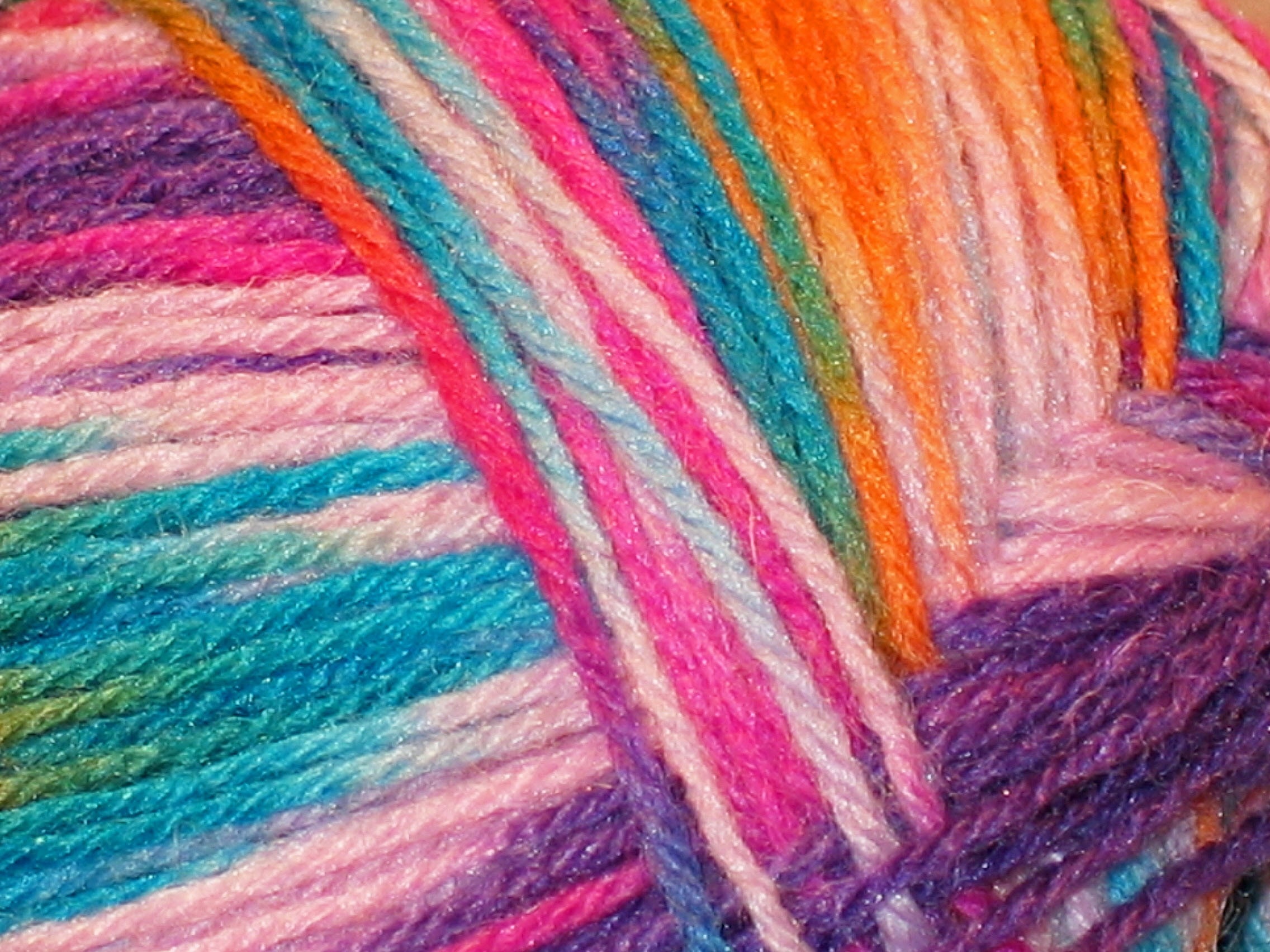 pink blue and purple yarn threads