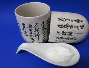 pair of white ceramic kanji print cups thumbnail