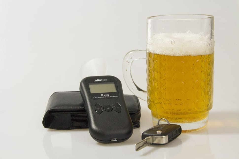 clear glass beer mug black car fob and black digital device preview
