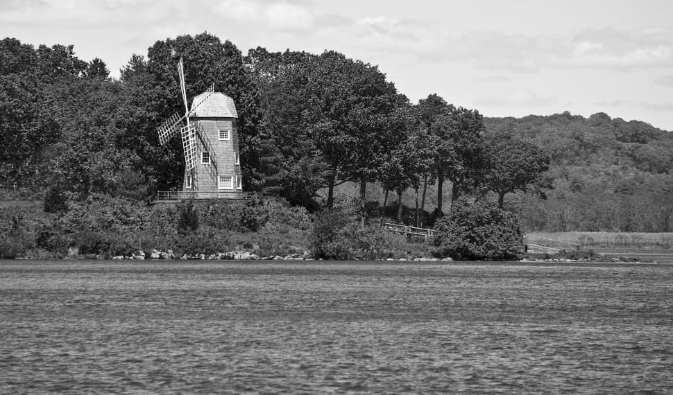 grayscale photography of farm with windmill preview