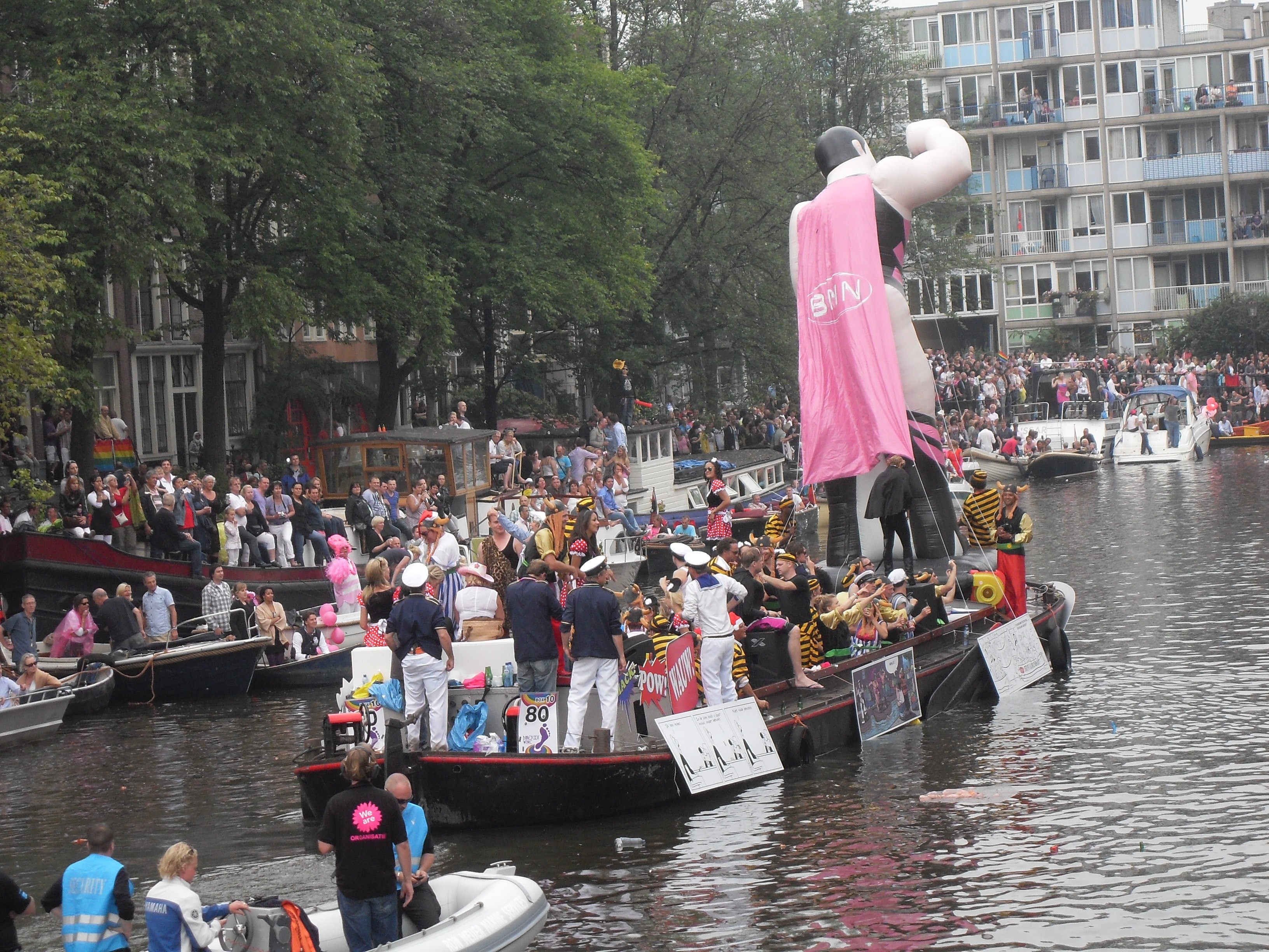 people with giant statue on boat