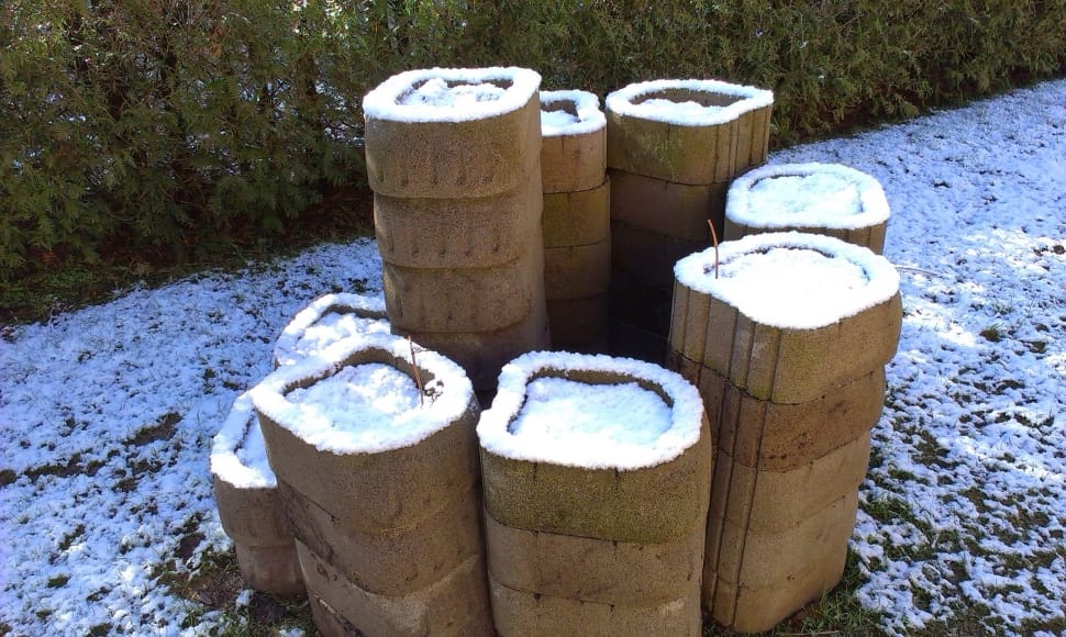 brown cylindrical containers on snowy field preview