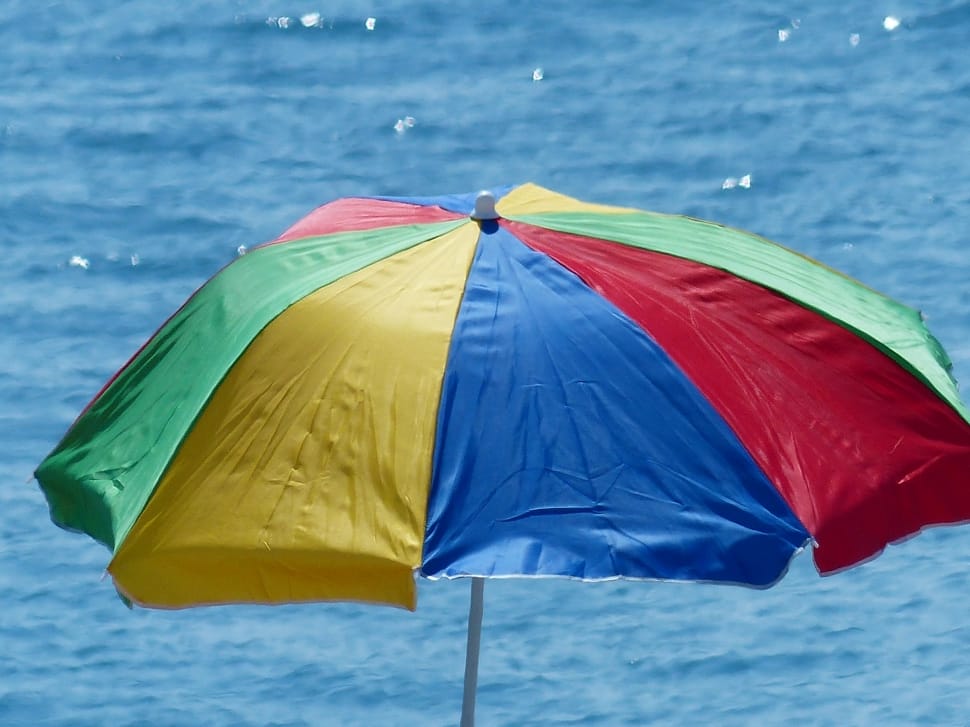 blue red and yellow beach umbrella preview