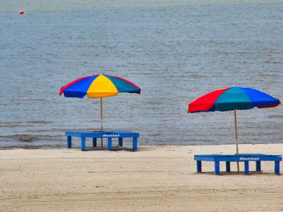 two beach chairs and parasols preview